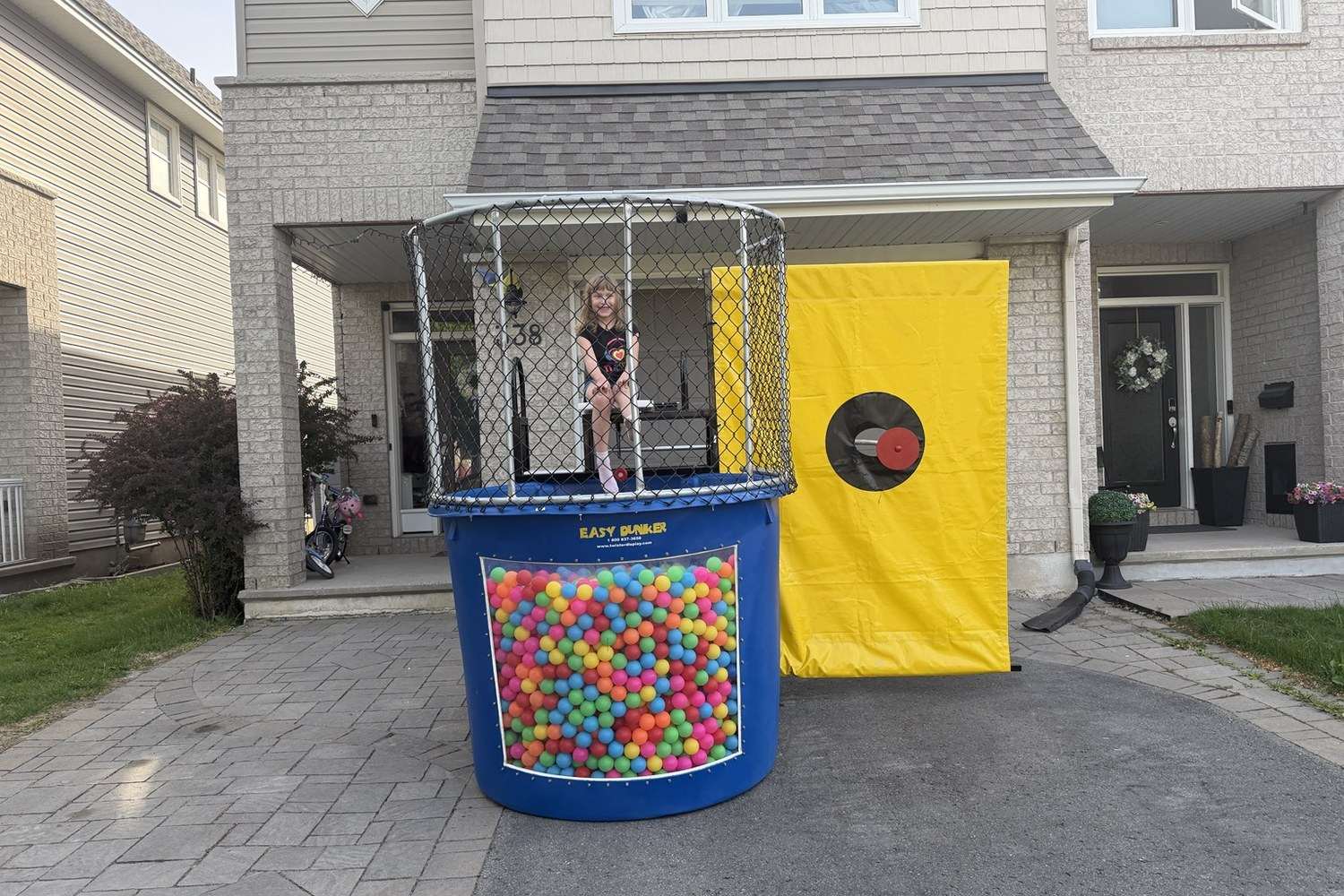 Pit ball dunk tank rental setup in Ottawa with colourful pit balls instead of water